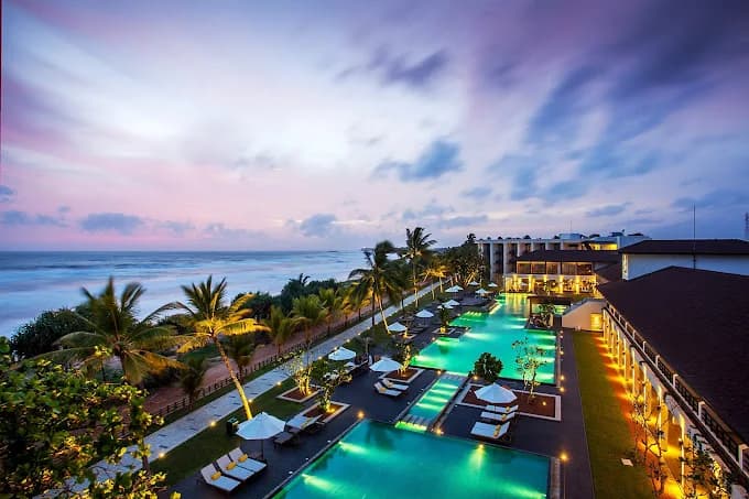 Centara resort pool and tropical gardens at sunset