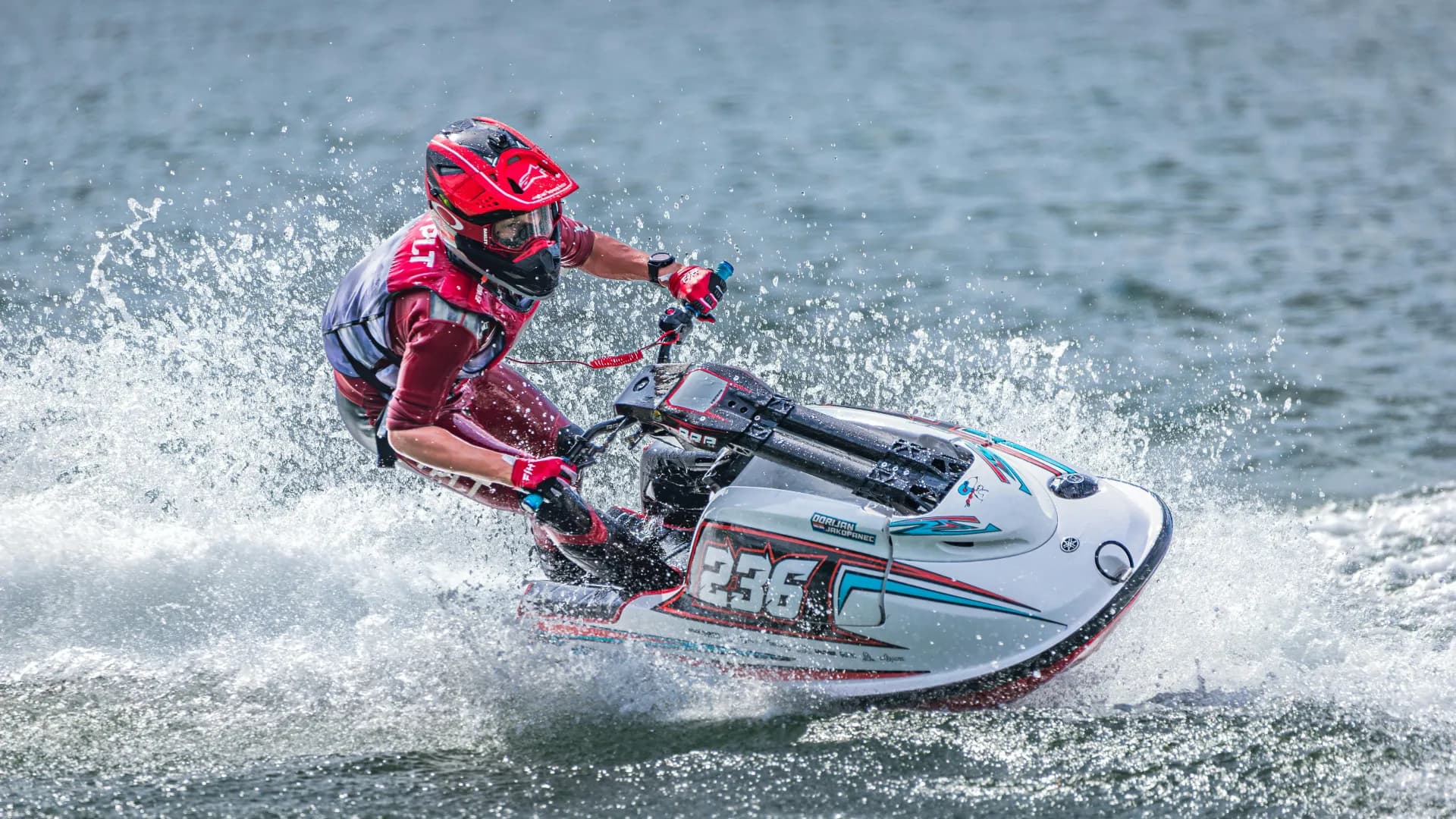 Jet ski racing across the calm waters of Bentota lagoon, Sri Lanka